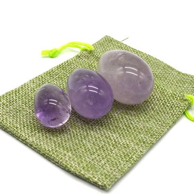 OEM acepta huevos de Yoni tallados para el ejercicio vaginal huevos de jade de amatista natural perforados