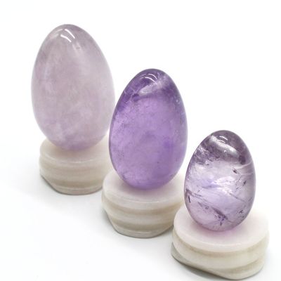 OEM acepta huevos de Yoni tallados para el ejercicio vaginal huevos de jade de amatista natural perforados