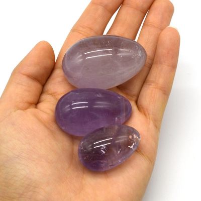OEM acepta huevos de Yoni tallados para el ejercicio vaginal huevos de jade de amatista natural perforados