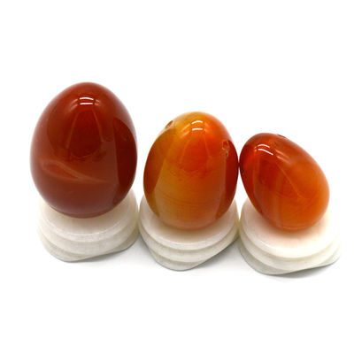OEM ODM Aceptado huevos rojos de carnelia yoni huevos de piedra semipreciosa huevos perforados estilo de masaje