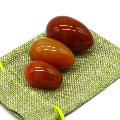 OEM ODM Aceptado huevos rojos de carnelia yoni huevos de piedra semipreciosa huevos perforados estilo de masaje