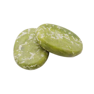 Piedra caliente curativa de Jade Xiuyan para masajes profesionales y relajación en spa.