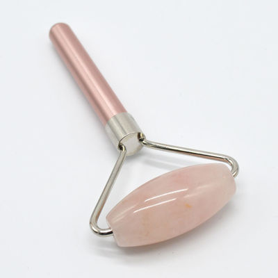 Roller de masaje facial natural de cuarzo rosa para una complexión renovada y revitalizada