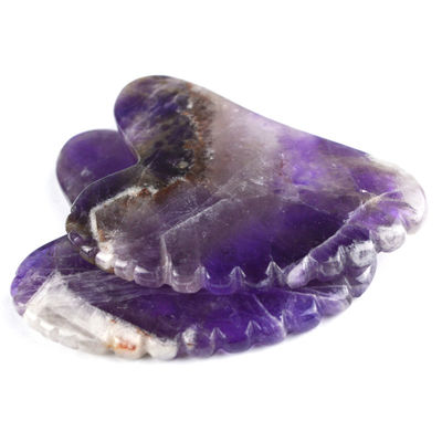 2024 Herramientas de masaje de moda Forma de corazón Ametista natural Gua Sha con dientes Logotipo personalizado Guasha Cuidado de la piel corporal