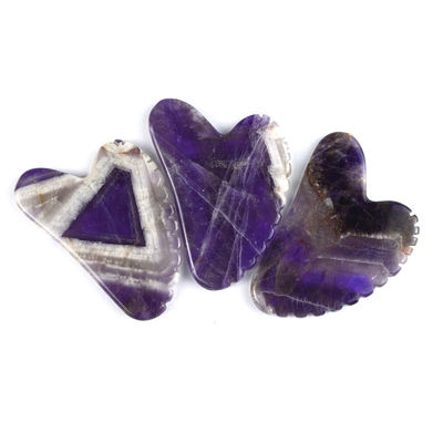 2024 Herramientas de masaje de moda Forma de corazón Ametista natural Gua Sha con dientes Logotipo personalizado Guasha Cuidado de la piel corporal
