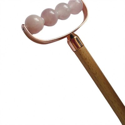 Masajeador facial portátil de cuarzo rosa de cabeza única Facial antiarrugas rodillo mango de madera