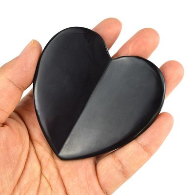 2024 Forma de corazón Natural Negro Piedra Bian Gua Sha Raspado Herramienta de masaje para el drenaje linfático Función de masaje muscular