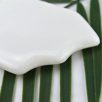 Propiedades Equipo de masaje corporal Jade blanco natural piedra blanca Gua Sha herramienta de raspado para el masaje de cuidado de la salud corporal