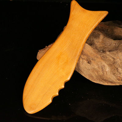 Tabla de Gua Sha de madera amarilla para la medicina tradicional china