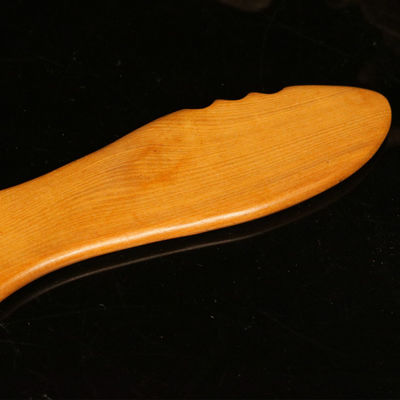 Tabla de Gua Sha de madera amarilla para la medicina tradicional china