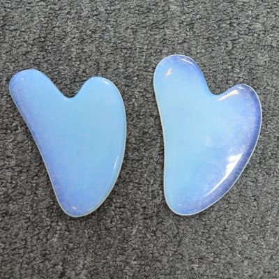 Técnico de piedra ópalo pulida Gua Sha raspado masajista para el cuidado de la piel y la desintoxicación