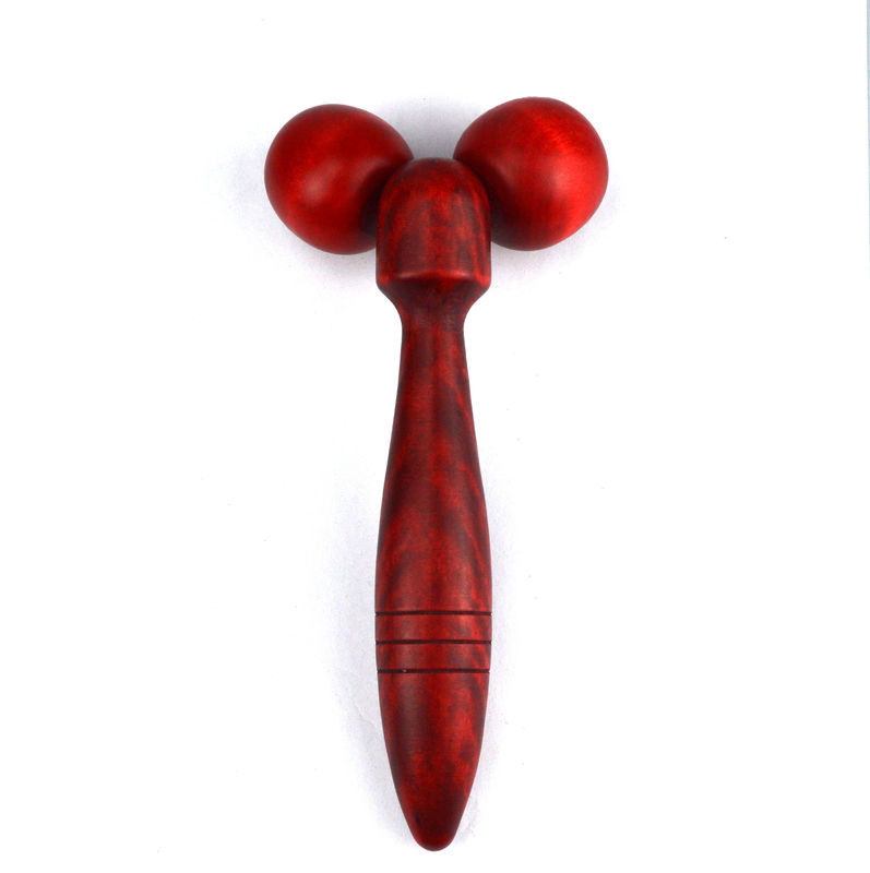 Roller de masaje de madera rojo o amarillo para la terapia facial y el tratamiento antiarrugas