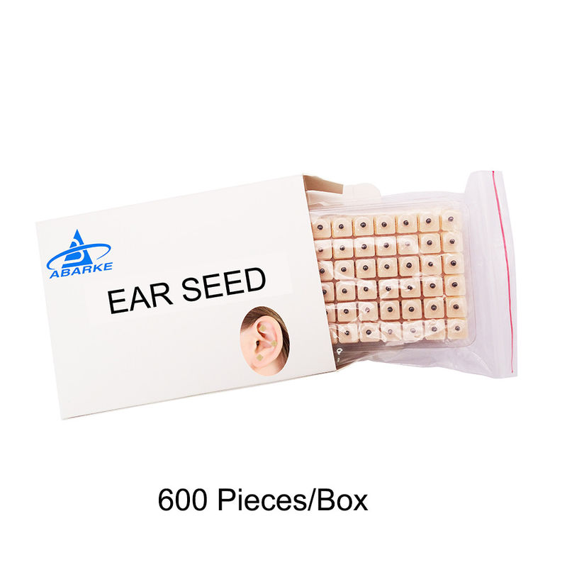 Agujas de acupuntura Masaje funcional 600 piezas/caja Semillas de prensa de oído desechables Kit de acupresión de semillas de oído multi-condición