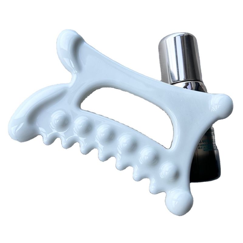 Experimenta los beneficios del drenaje linfático con nuestra herramienta de masaje de cerámica Gua Sha.