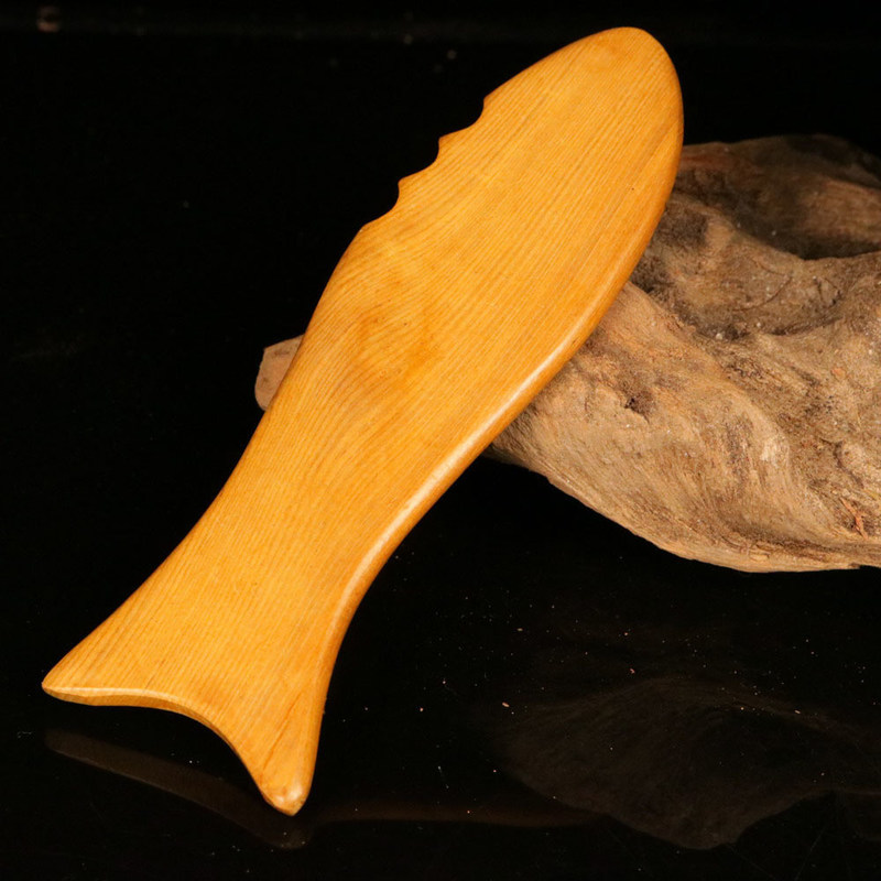 Tabla de Gua Sha de madera amarilla para la medicina tradicional china